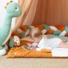 Baby in their room with the diplododo decorative braid