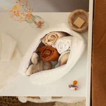 Open baby toiletry bag with baby essentials.