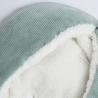 Close-up materiaal saliegroen voetenzak baby