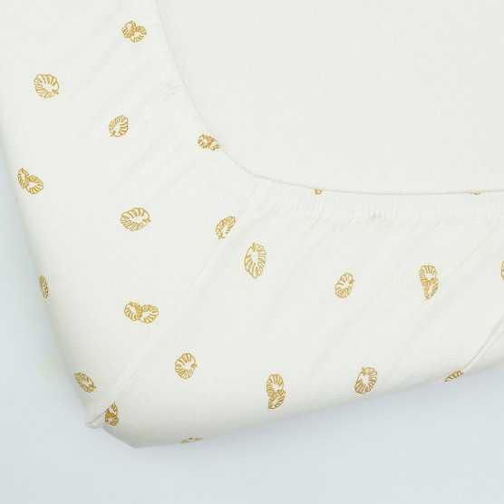 Drap housse écru avec des motifs feuilles
