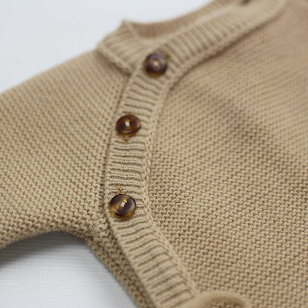 Detail of buttons on the knitted baby cardigan