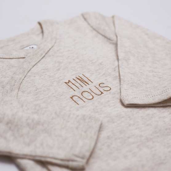 Beige baby bodysuit