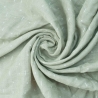 muselina bebé verde con motivo blanco