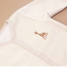 detail of baby pajama with embroidered patch
