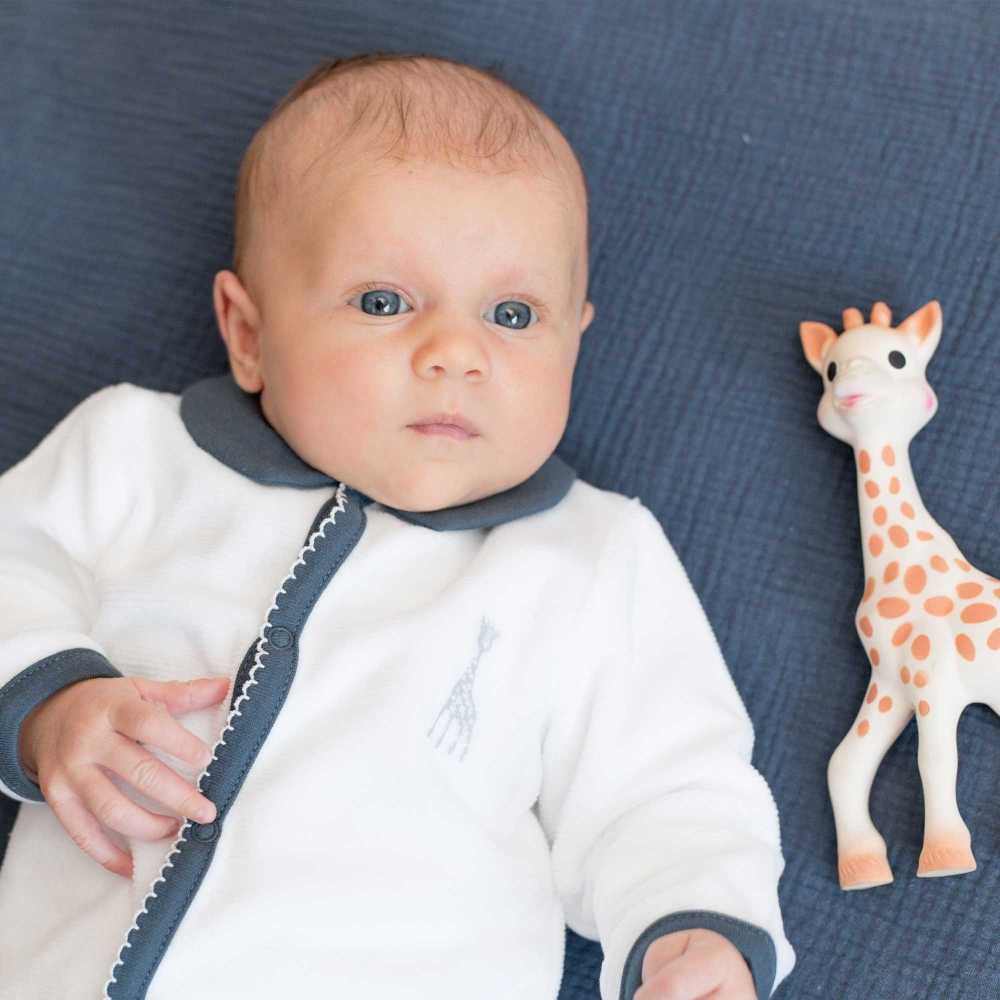 Little girl and her embroidered Sophie the Giraffe pajamas