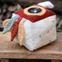 baby awakening toy on its wooden stool