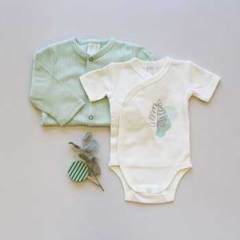 Staging of the ecru bodysuit with a sage corduroy pajama