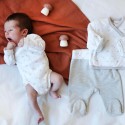 baby in bodysuit