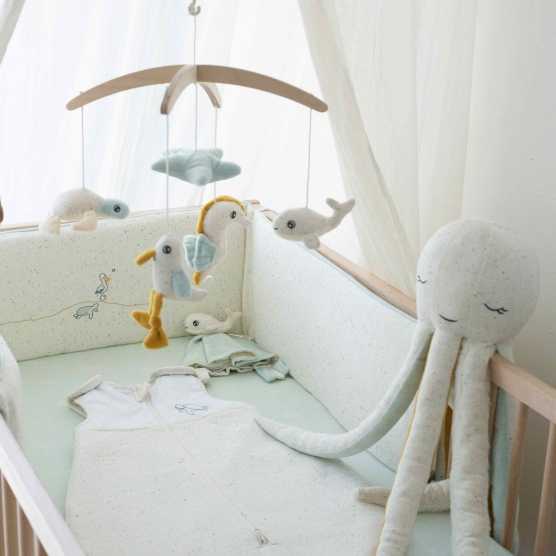 beige and light green crib bumper for high position crib