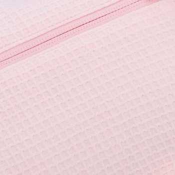 Nahaufnahme des Wabenstoffs aus reiner Baumwolle in Rosa