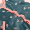 Close-up of the small apple pattern and velvet material of the pajama