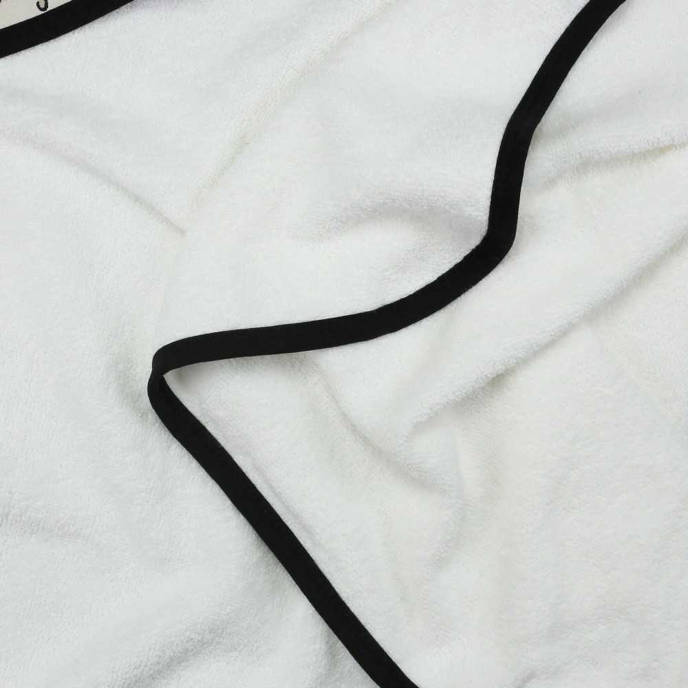 Zoom matière sur l"ponge 100% coton de la cape de bain bébé