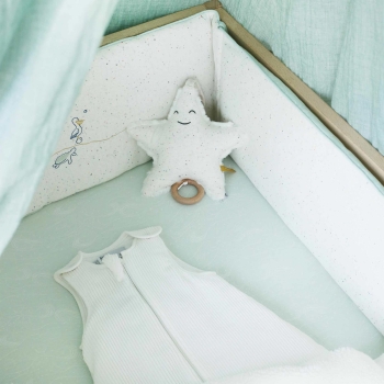 newborn sleeping bag in a baby crib with ocean theme